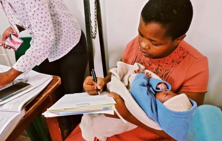 A mother registering her newborn at a clinic in Matsapha, Eswatini.